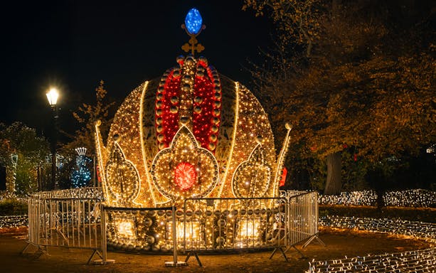 Illuminated crown decoration at Schönbrunn Palace during Vienna Christmas Tour.