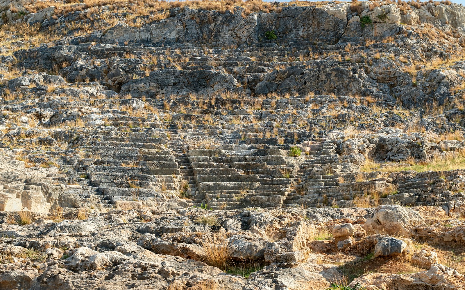Ancient stone seating at the theater of Lindos, Rhodes, Greece.