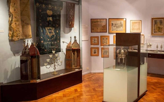 Jewish artifacts and historical displays in a Buenos Aires museum exhibit.