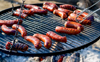 Barbeque sausages grilling during Quad Biking Adventure in Zakopane.