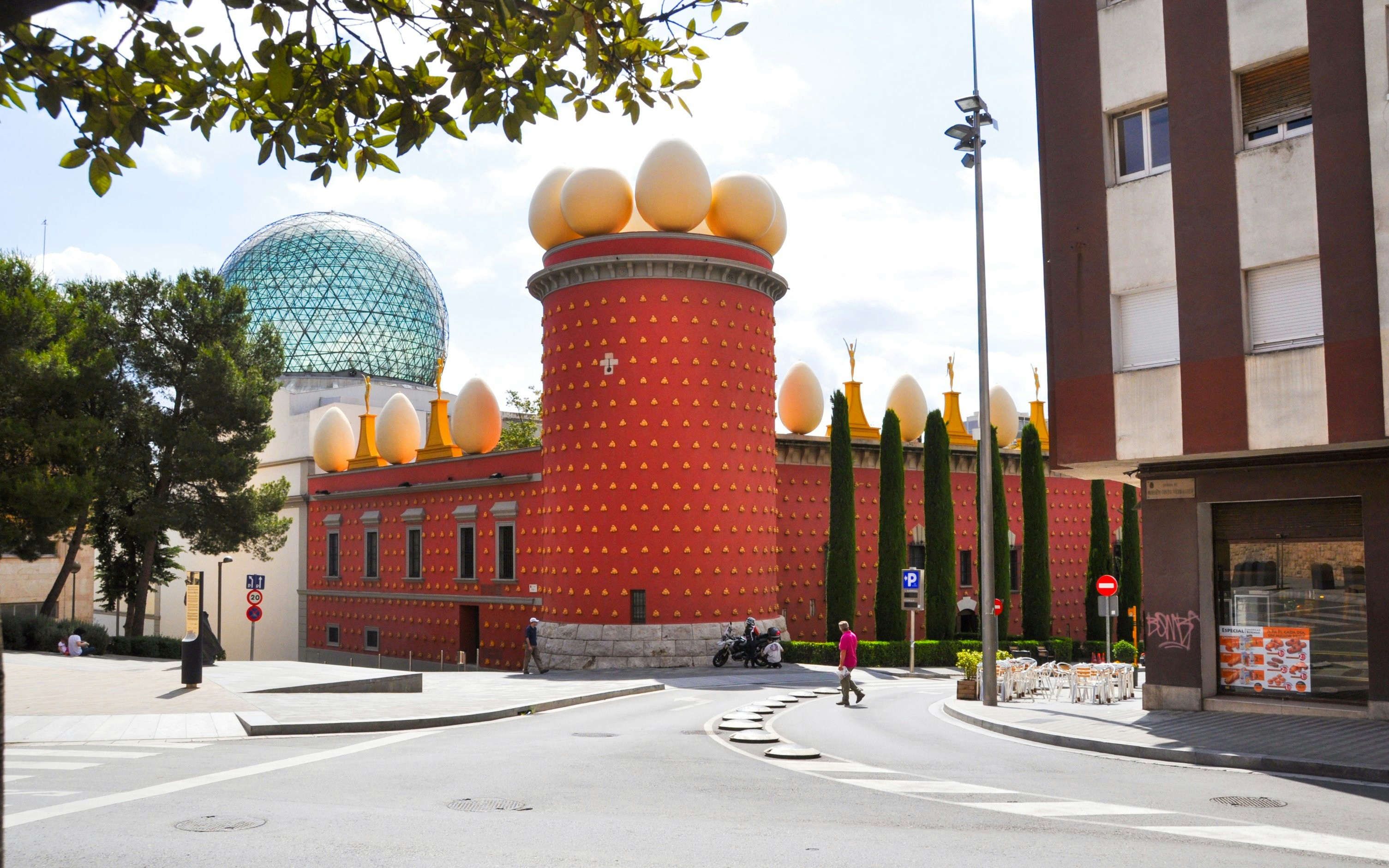 Dalí House Museum in Figueres with egg sculptures and geodesic dome.