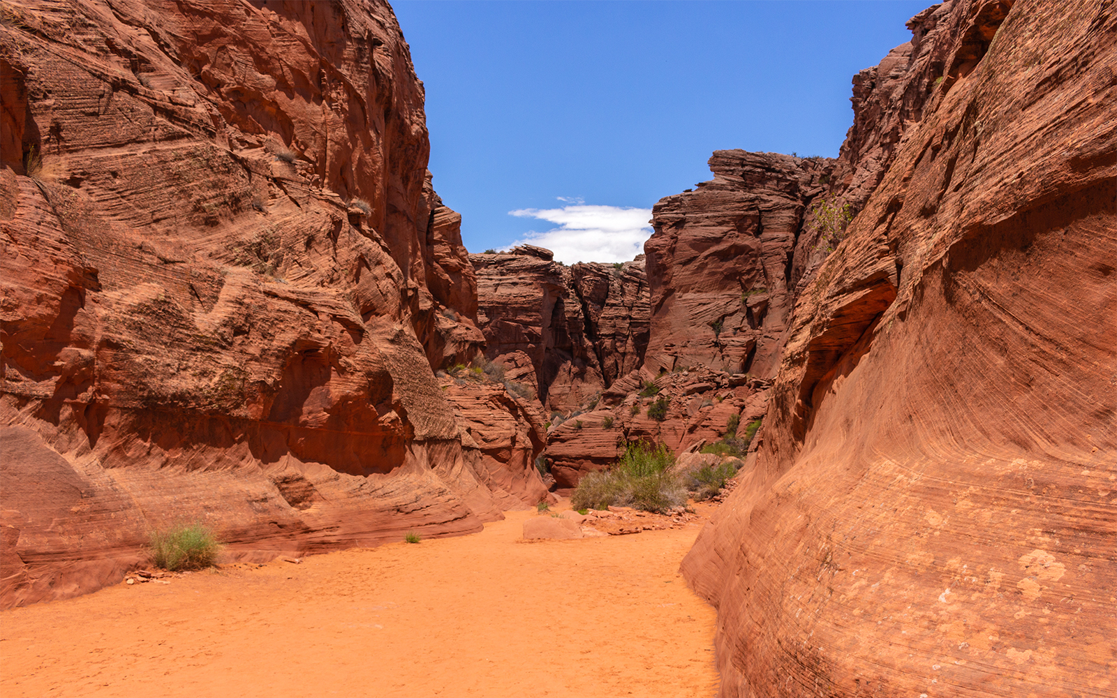Entrance to Antelope Canyon X, showcasing red rock formations in Page, Arizona.