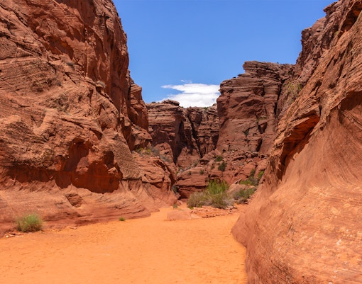 Entrance to Antelope Canyon X, showcasing red rock formations in Page, Arizona.