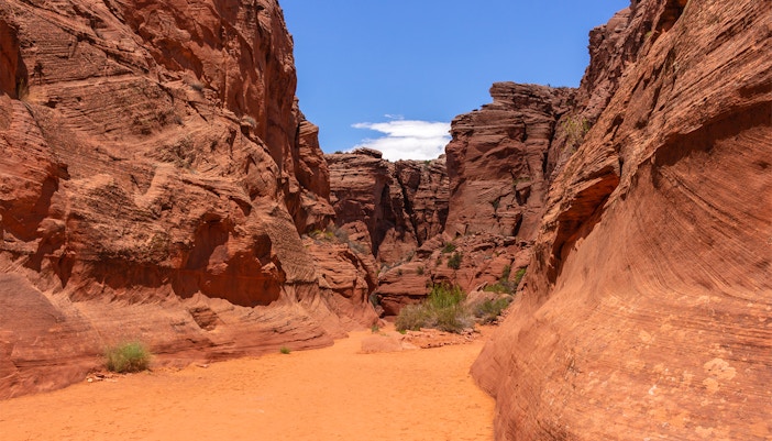 Entrance to Antelope Canyon X, showcasing red rock formations in Page, Arizona.
