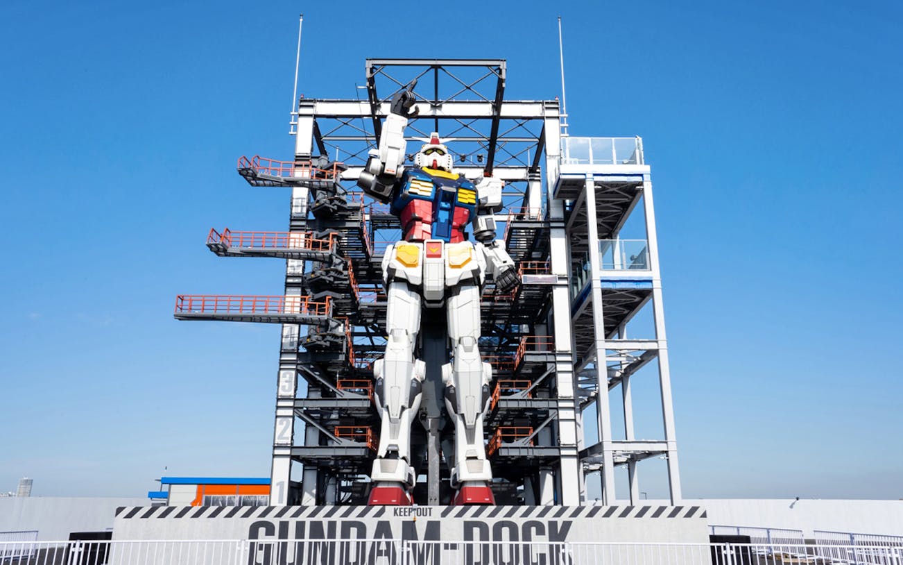 Giant Gundam statue at GUNDAM FACTORY YOKOHAMA with scaffolding, Yokohama, Japan.