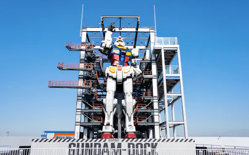 Giant Gundam statue at GUNDAM FACTORY YOKOHAMA with scaffolding, Yokohama, Japan.
