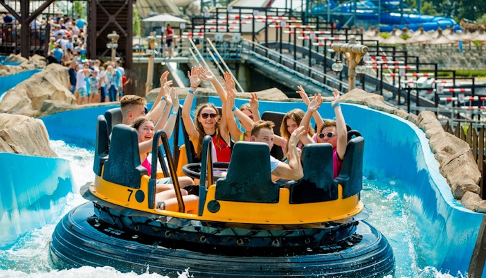 Energylandia Jungle Adventure ride with vibrant jungle-themed decor and thrilling roller coaster tracks.