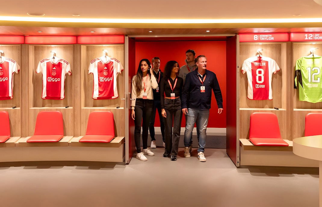 Visitors touring the Johan Cruijff ArenA locker room in Amsterdam.