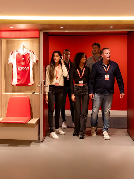 Visitors touring the Johan Cruijff ArenA locker room in Amsterdam.