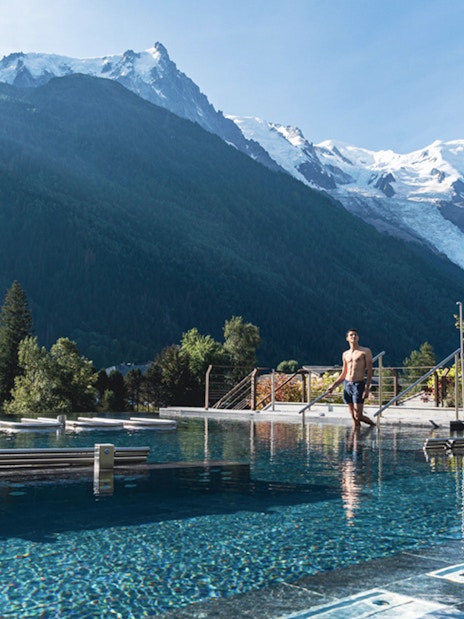Outdoor pool at QC Terme Chamonix with Mont Blanc view.