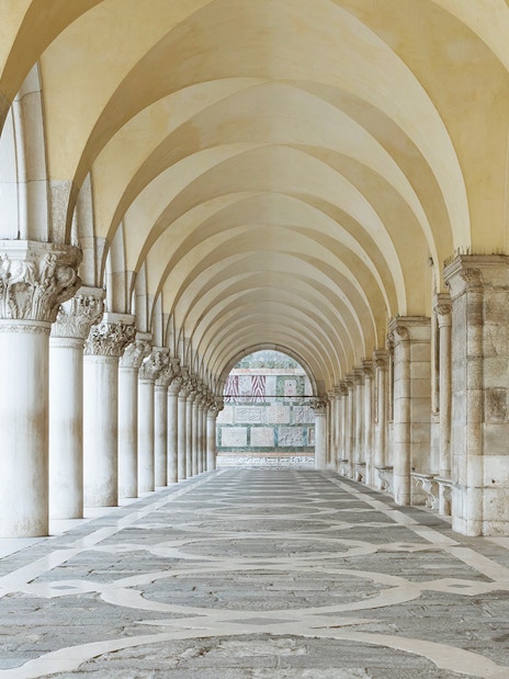 Archway with columns under Doge's Palace in San Marco Square, Venice.