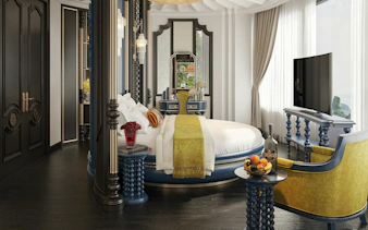 Luxury suite interior on La Casta Star Cruise, Lan Ha Bay, with round bed and elegant decor.