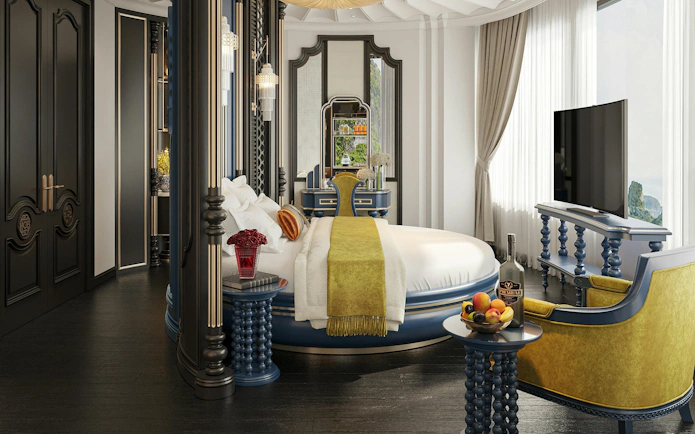 Luxury suite interior on La Casta Star Cruise, Lan Ha Bay, with round bed and elegant decor.