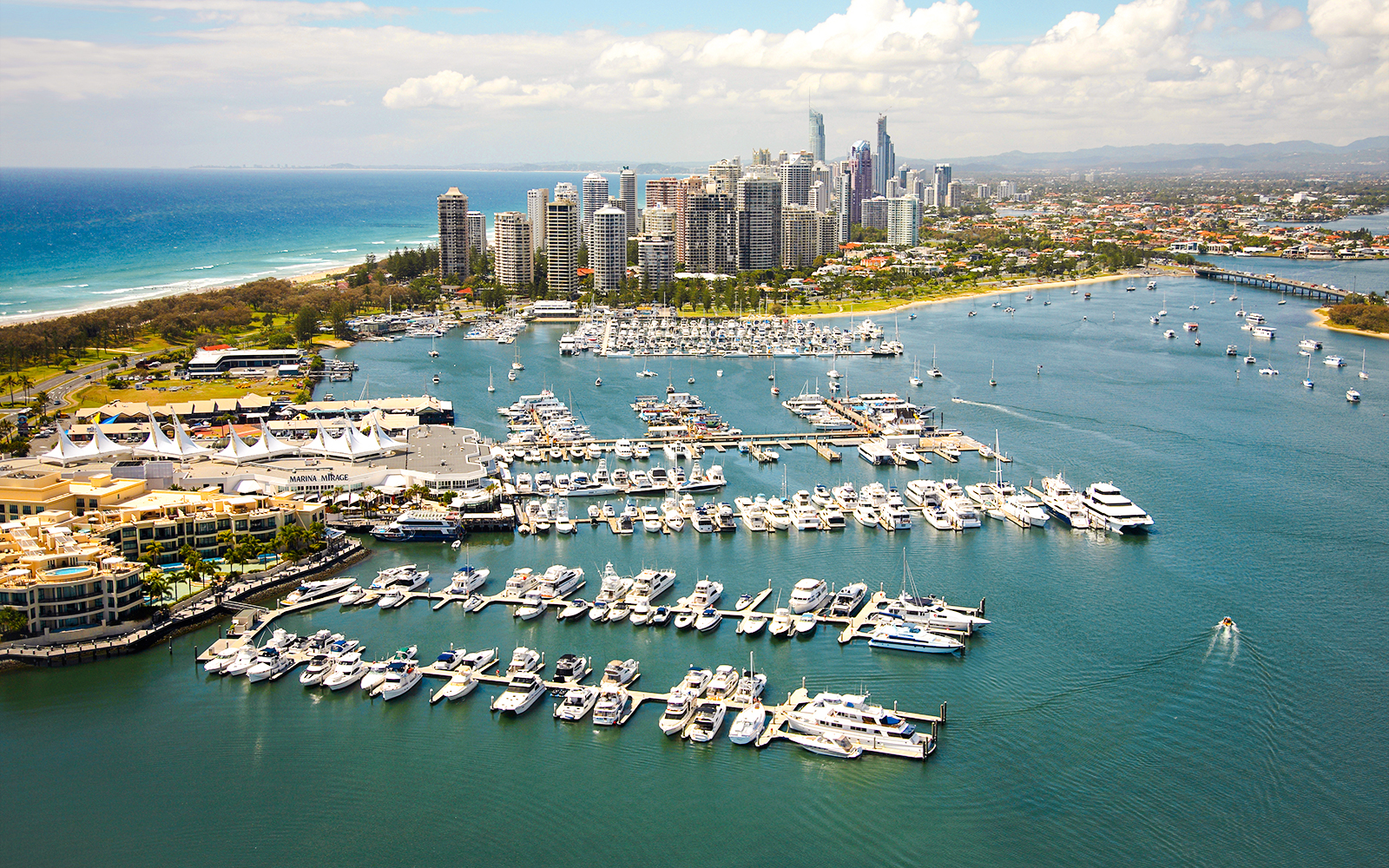 Main Beach Marina with yachts and city skyline, Gold Coast.