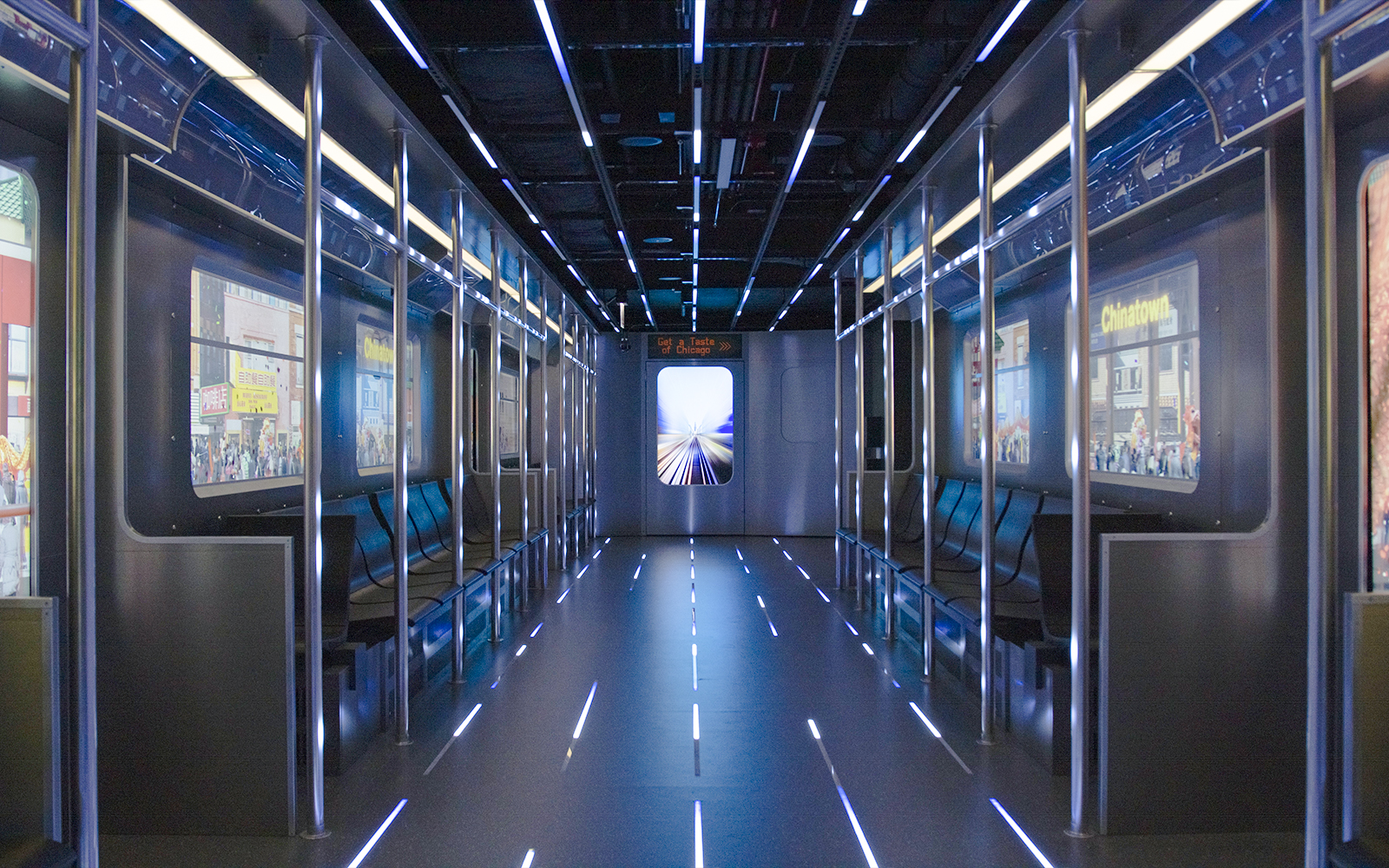 Replica of the L train interior at Skydeck Chicago with cityscape views.