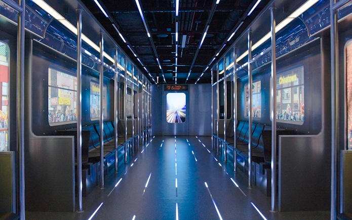 Replica of the L train interior at Skydeck Chicago with cityscape views.