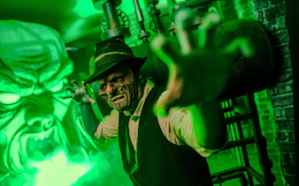 Haunted character reaching out at Knott's Berry Scary Farm, Southern California.