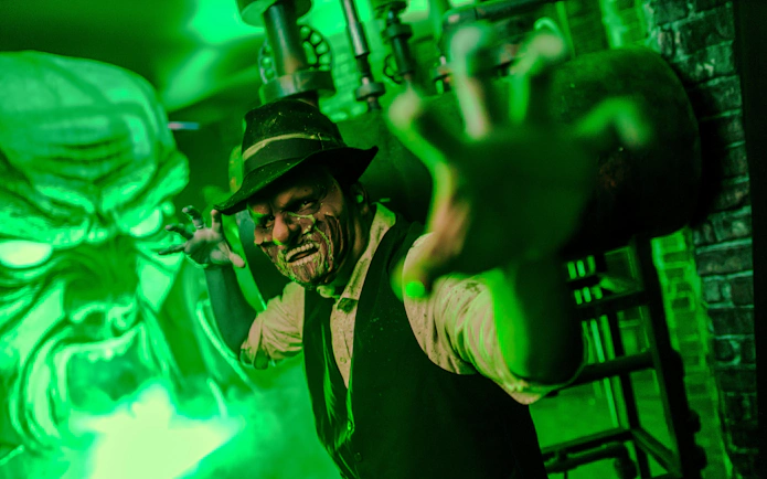 Haunted character reaching out at Knott's Berry Scary Farm, Southern California.