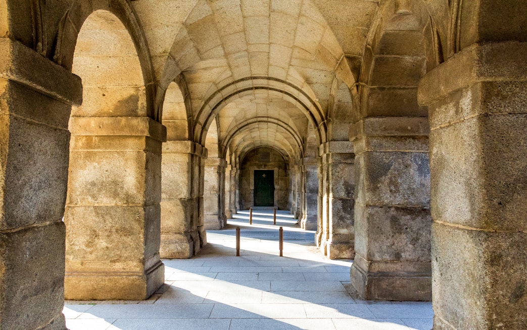 Stone archway at San Lorenzo de El Escorial, Spain, during a private tour.