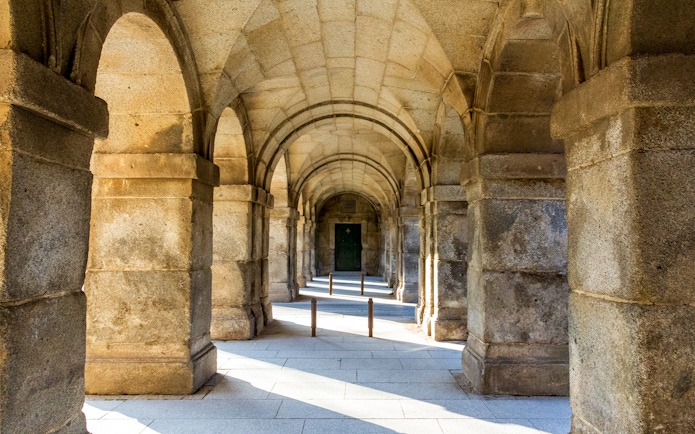 Stone archway at San Lorenzo de El Escorial, Spain, during a private tour.