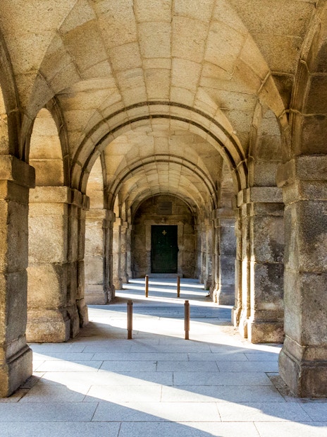 Stone archway at San Lorenzo de El Escorial, Spain, during a private tour.