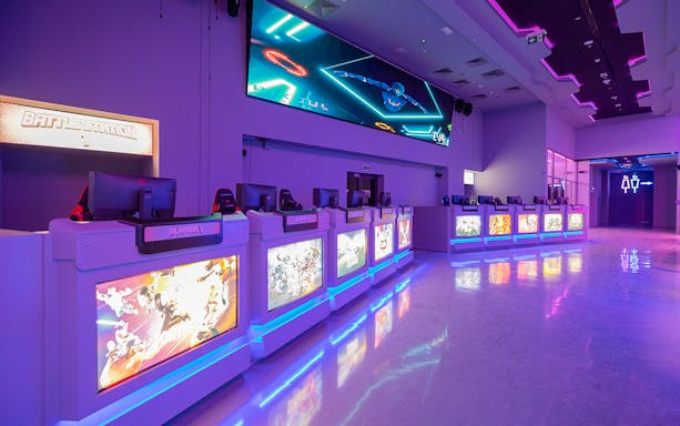 Gaming stations with neon lights at Pixoul Gaming, Abu Dhabi.