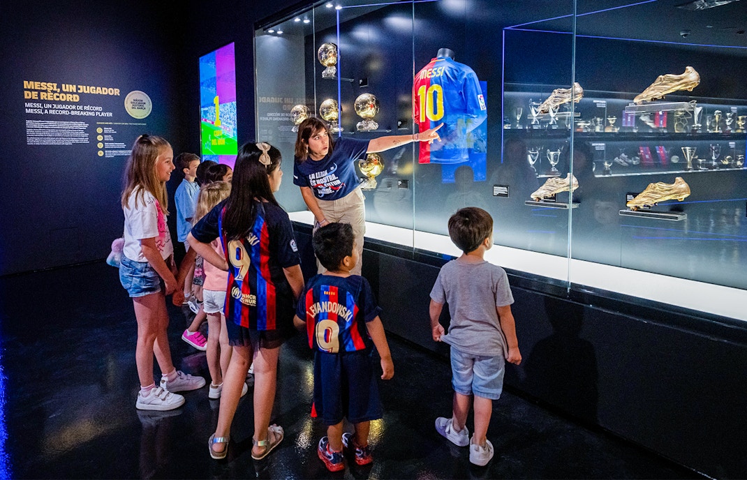 Camp Nou Barca Museum immersive tour showcasing football memorabilia and interactive exhibits.