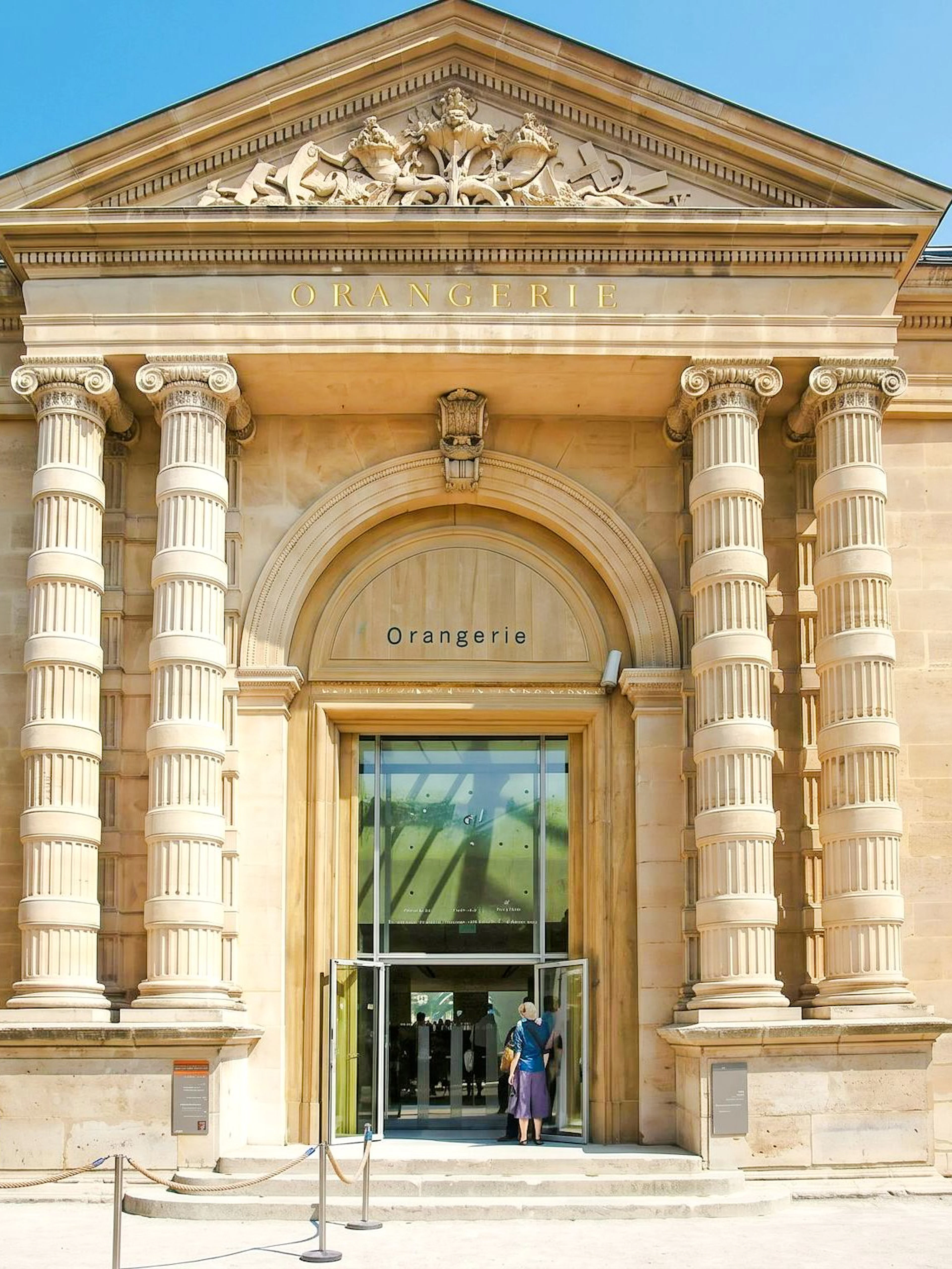 Musée de l’Orangerie entrance with neoclassical columns in Paris.
