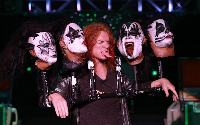 Performer with theatrical masks at Carrot Top show in Las Vegas.