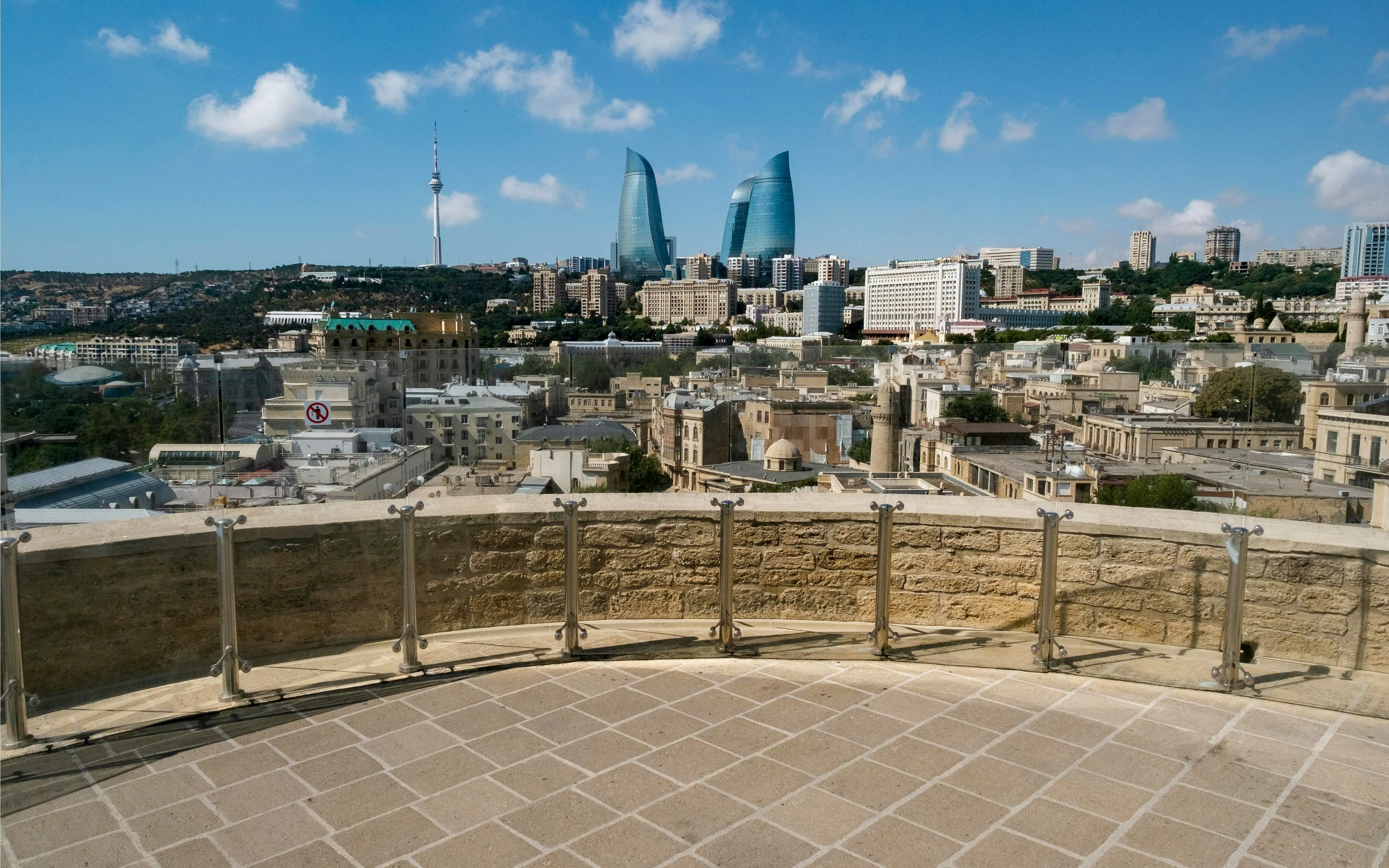 View from Maiden Tower Museum overlooking Baku cityscape with Flame Towers in the distance.