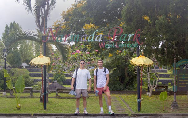 Travelers standing in front of Narmada Park entrance, West Lombok.