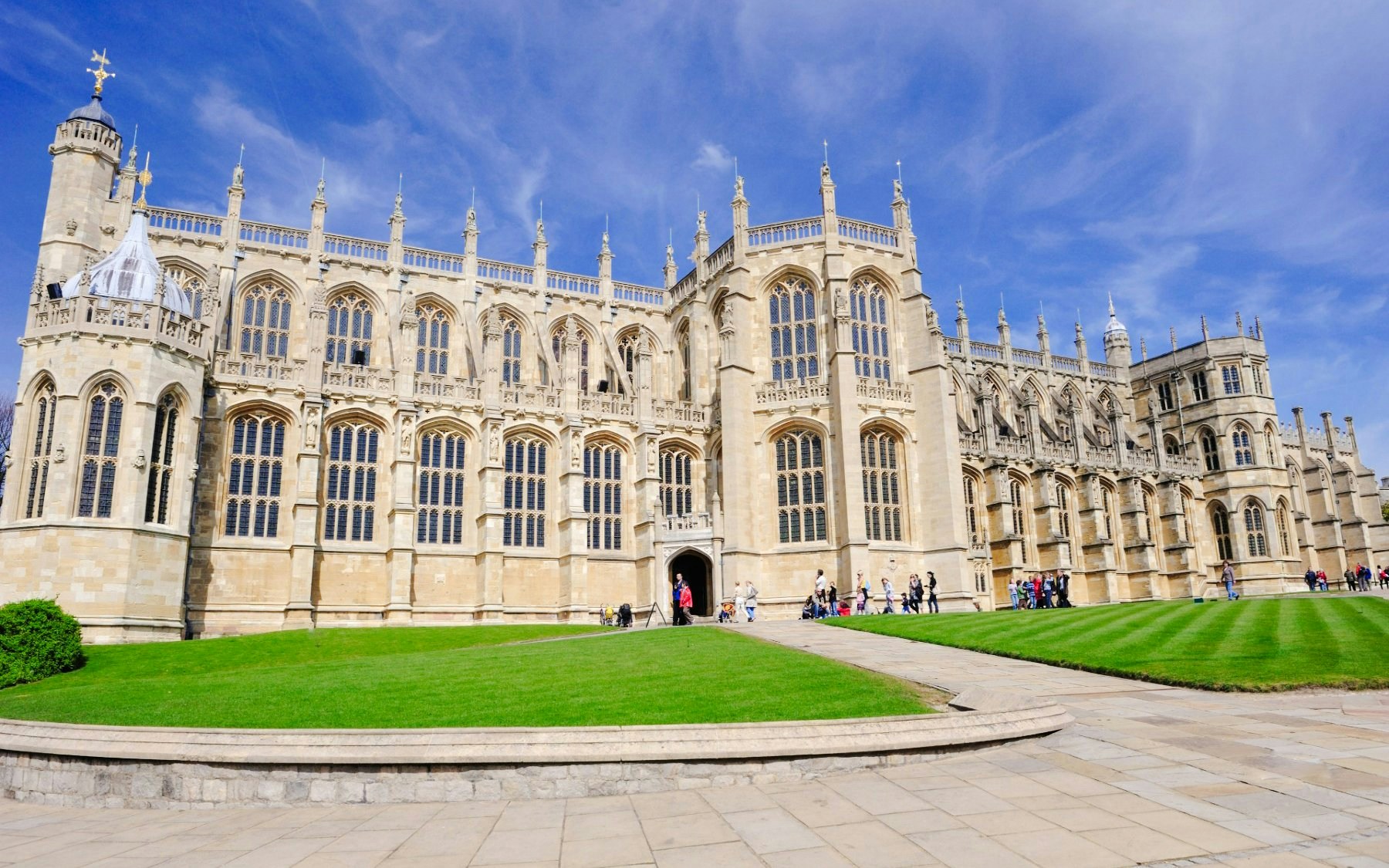 St George's Chapel at Windsor Castle with visitors on a sunny day.