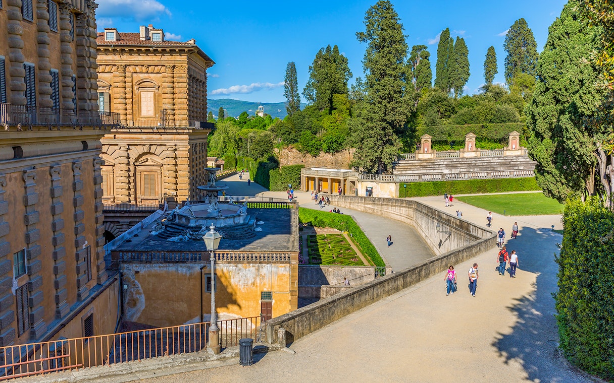 Visitors walking in Boboli Gardens at Pitti Palace, Florence.