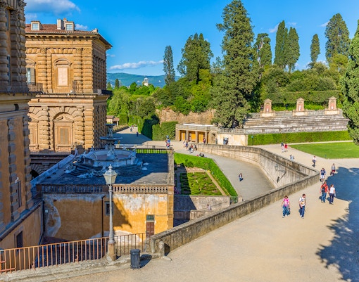 Visitors walking in Boboli Gardens at Pitti Palace, Florence.