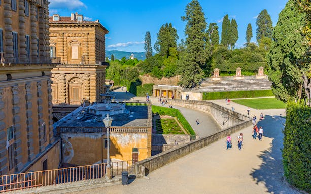 Visitors walking in Boboli Gardens at Pitti Palace, Florence.