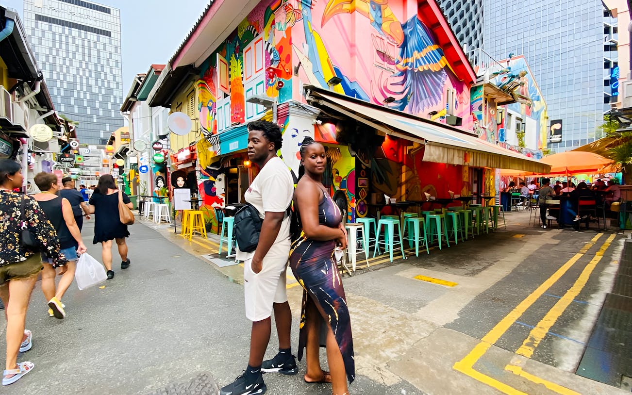 Colorful street art and people in Kampong Gelam, Singapore, during a guided city highlights tour.