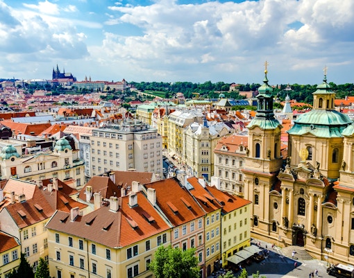 View of Prague's Old Town from the Old Town Hall tower, featuring St. Nicholas Church.