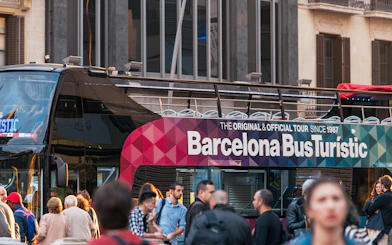 Barcelona Bus Turistic with passengers boarding for a city tour.
