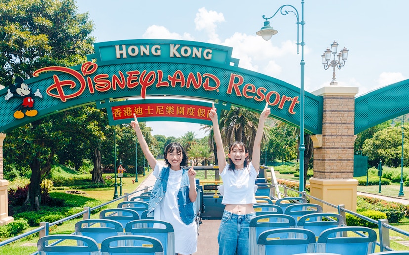 Tourists on a bus at Hong Kong Disneyland Resort entrance, Lantau Island.
