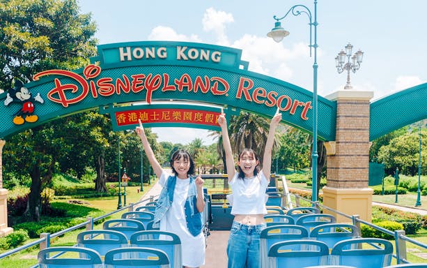Tourists on a bus at Hong Kong Disneyland Resort entrance, Lantau Island.