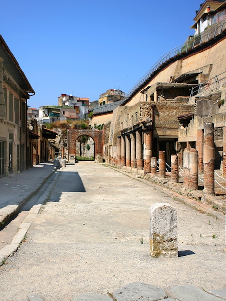 Ancient street with ruins and columns in Herculaneum, Italy.