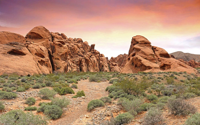 Valley of Fire red rock formations under a colorful sky on a guided tour from Las Vegas.