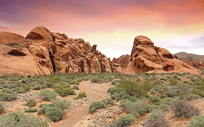 Valley of Fire red rock formations under a colorful sky on a guided tour from Las Vegas.