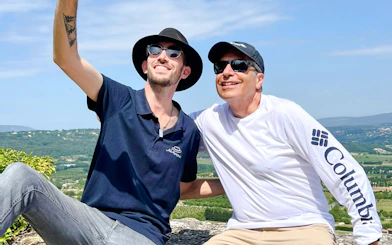 Two people taking a selfie with a scenic view near Pont de Galetas.