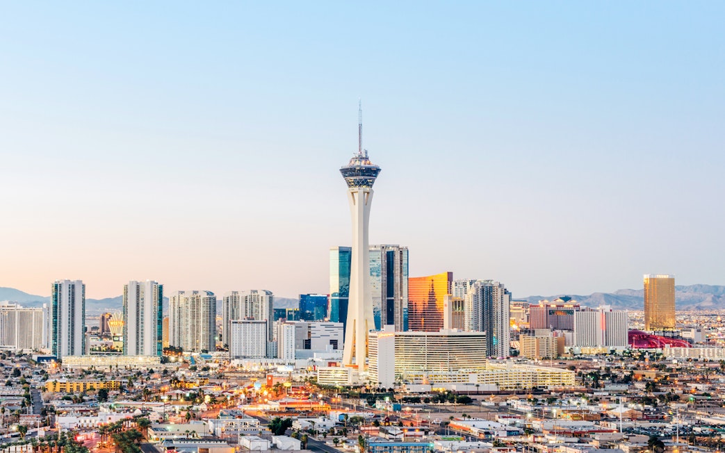 Las Vegas skyline at dusk with Stratosphere Tower, also known as The STRAT Hotel.