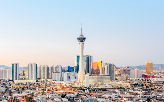 Las Vegas skyline at dusk with Stratosphere Tower, also known as The STRAT Hotel.