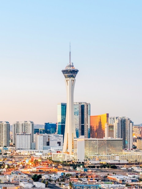 Las Vegas skyline at dusk with Stratosphere Tower, also known as The STRAT Hotel.