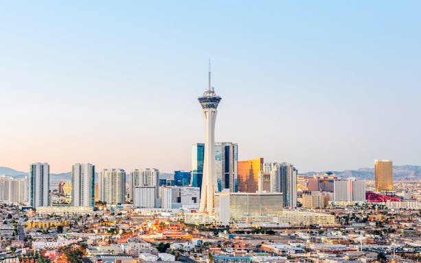 Las Vegas skyline at dusk with Stratosphere Tower, also known as The STRAT Hotel.