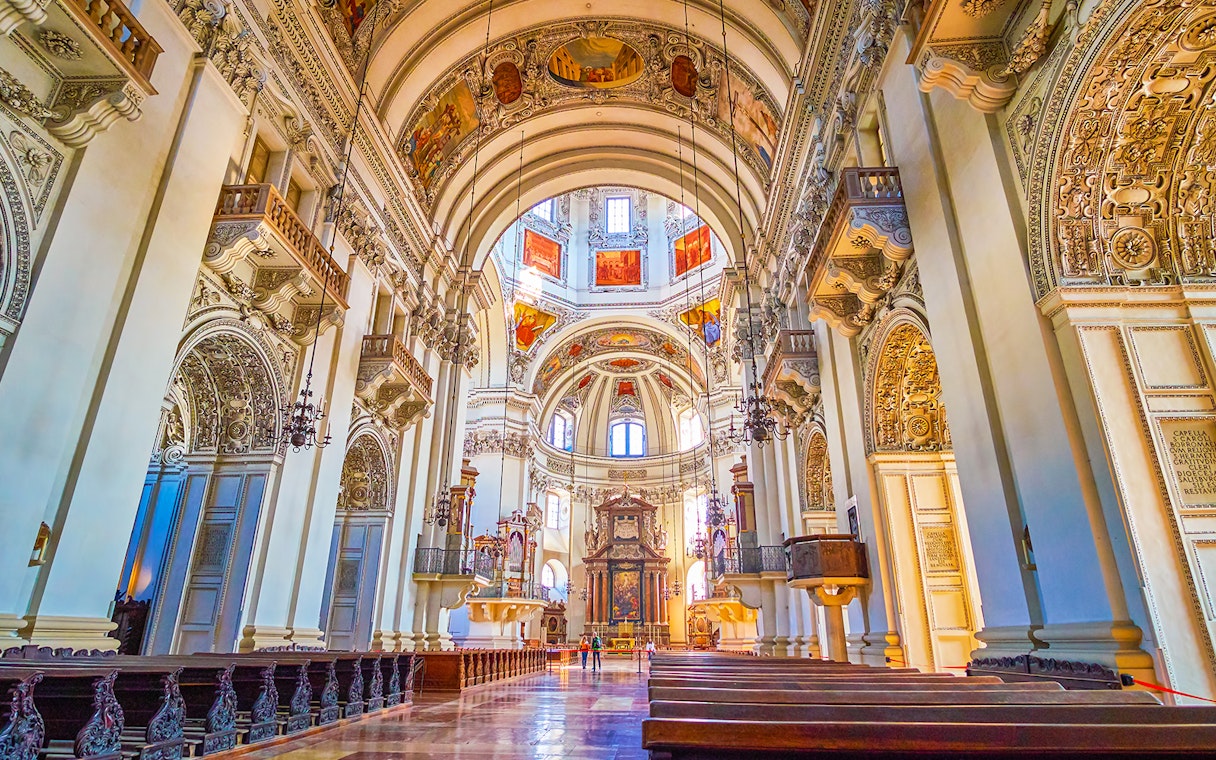 Salzburg Cathedral interior with ornate arches and detailed frescoes, part of Salzburg tour.
