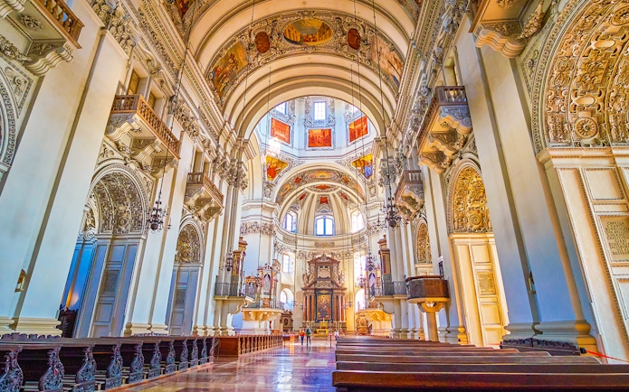 Salzburg Cathedral interior with ornate arches and detailed frescoes, part of Salzburg tour.